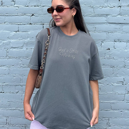 God's Still Working Unisex Tee